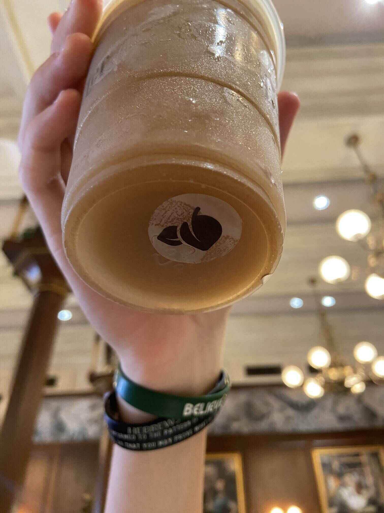 cup of frozen vegan butter beer at universal studios orlando